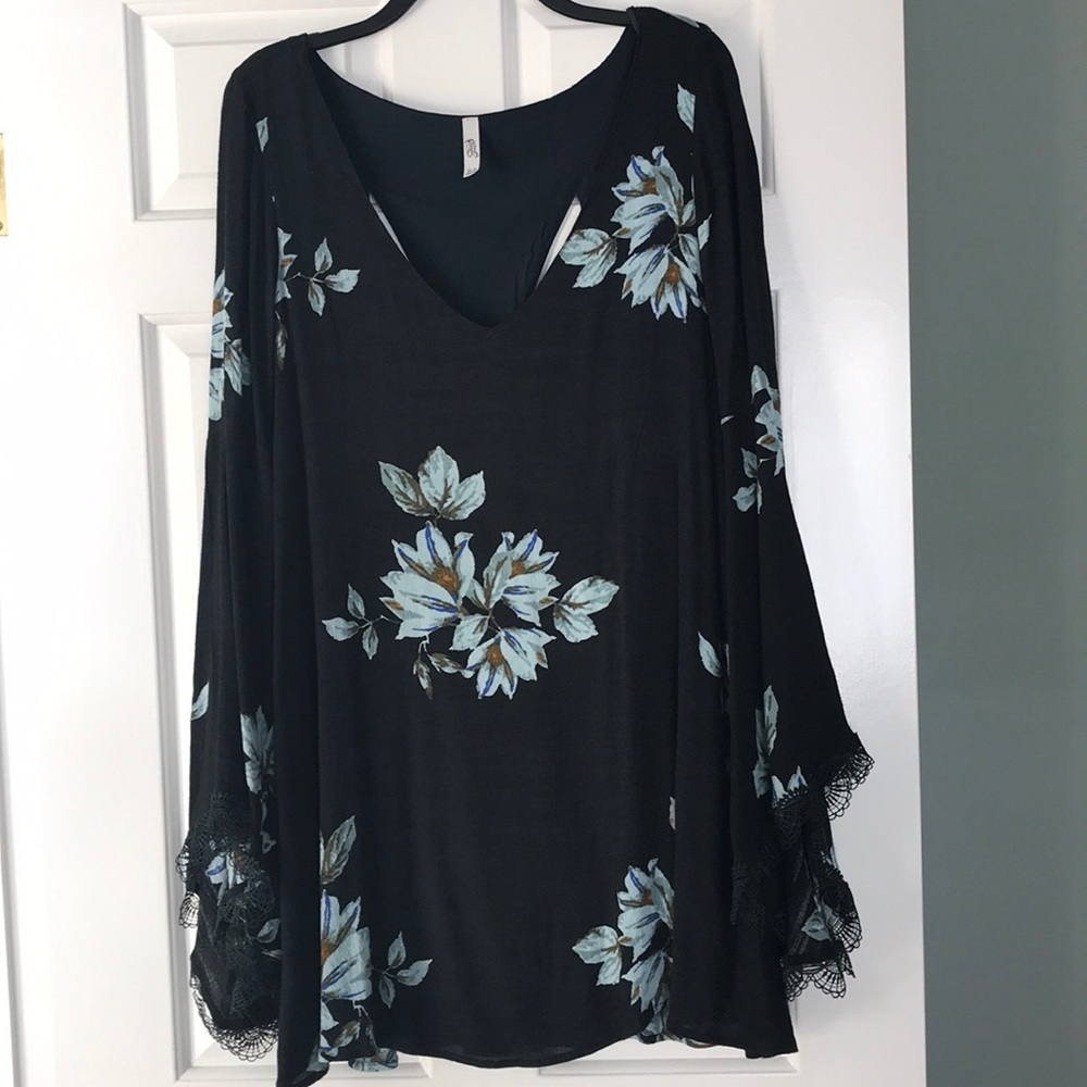 Very flattering navy blue floral dress.